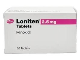 Bottle of Oral Minoxidil 2.5mg tablets for hair regrowth next to water glass